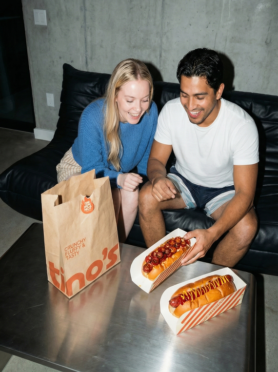 Couple eating hotdogs